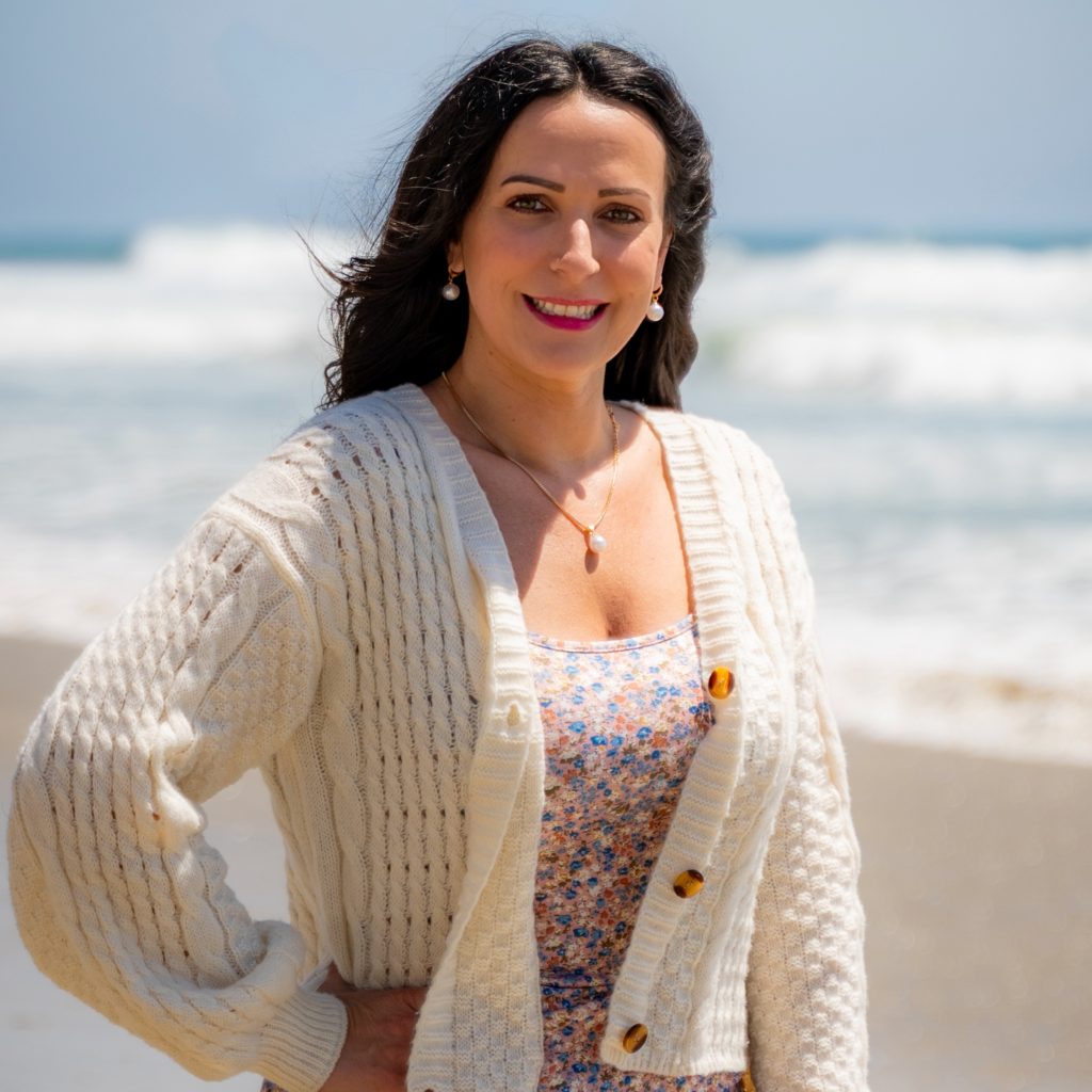 Blair Nicole is a self-love coach and self-compassion coach for women. photo of Blair Nicole, on beach