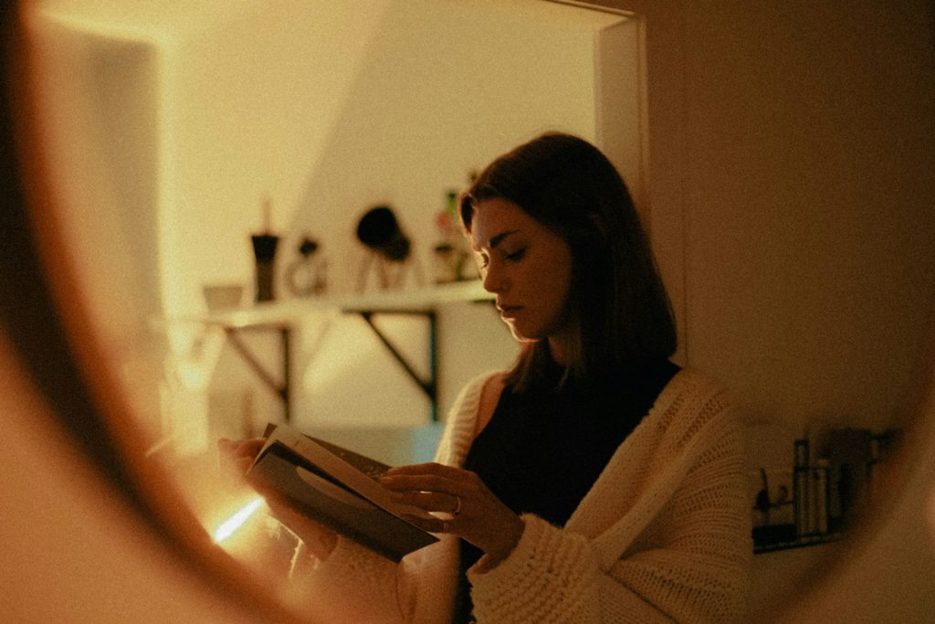 woman in white sweater using tablet computer, journaling, self-care 