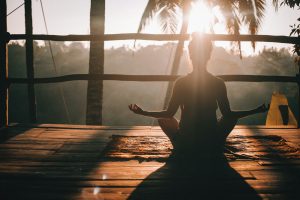 woman in black tank top sitting on brown wooden dock during daytime, blog post about best health affiliate programs in 2025
