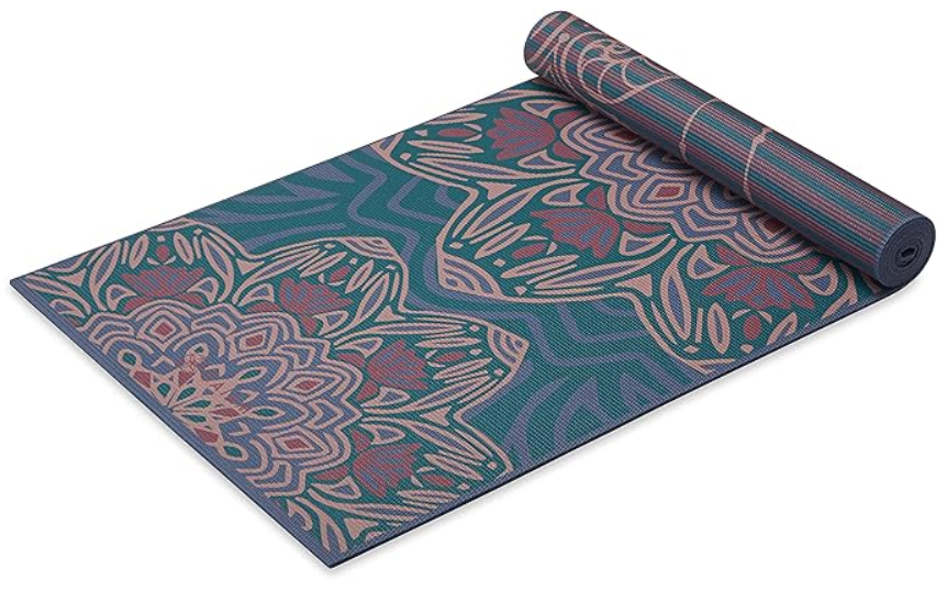 extra-thick yoga mat rolled out on floor ready for home yoga or Pilates practice 
