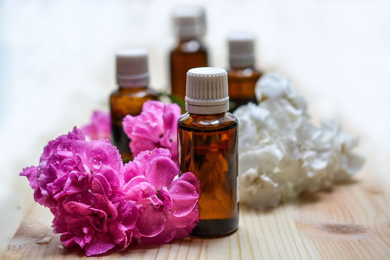 essential oil diffuser with small amber bottles creating a spa-like atmosphere at home, great as a self care gift idea