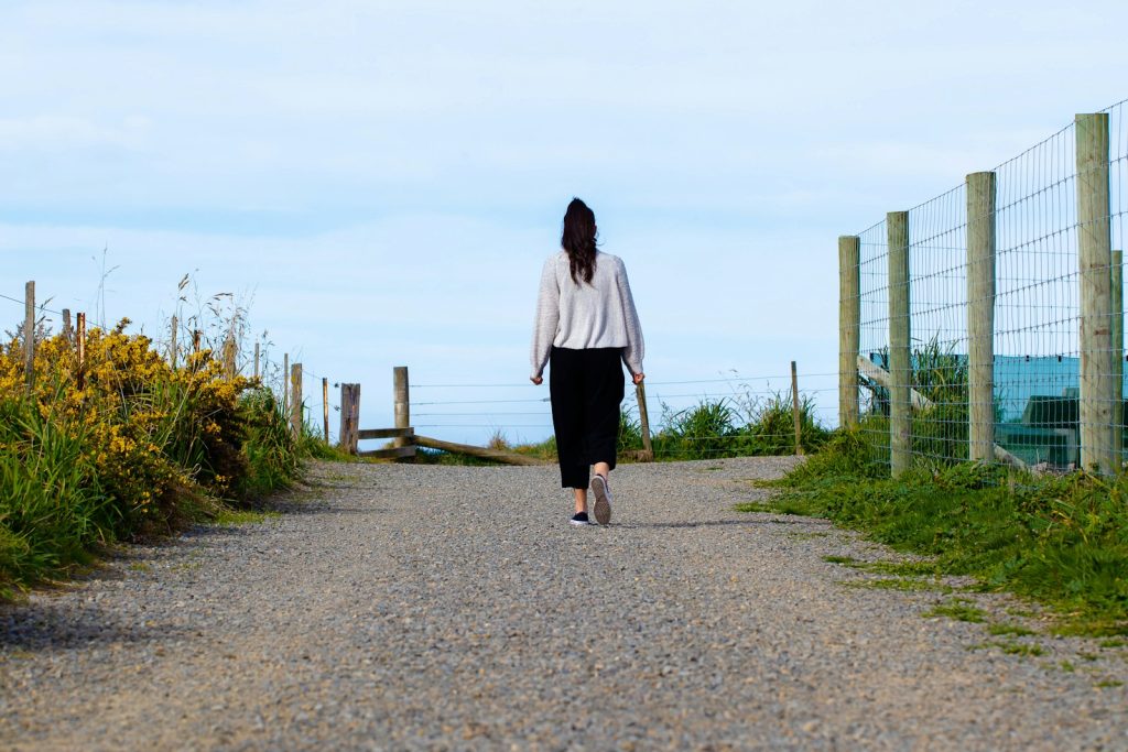 woman walking along path, walking away, setting boundaries