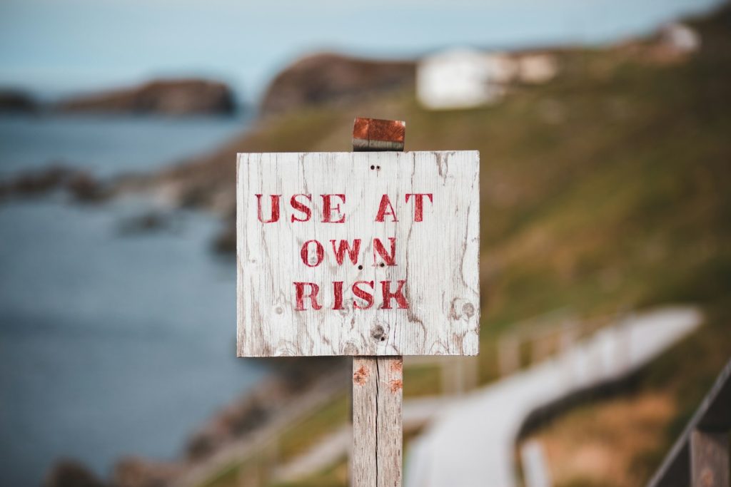 white and red wooden no smoking sign, risks of ai for mental health