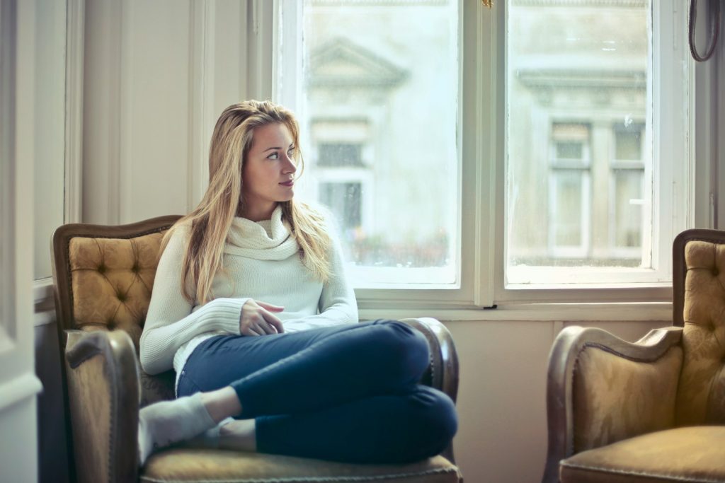 woman in chair - Blair Nicole | Mental Health, Relationships, Travel woman sitting on brown armchair